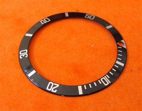 genuine rolex submariner bezel insert.